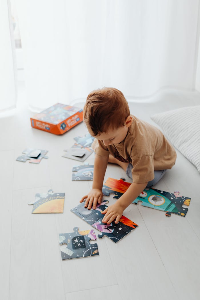 Boy Putting Together a Puzzle